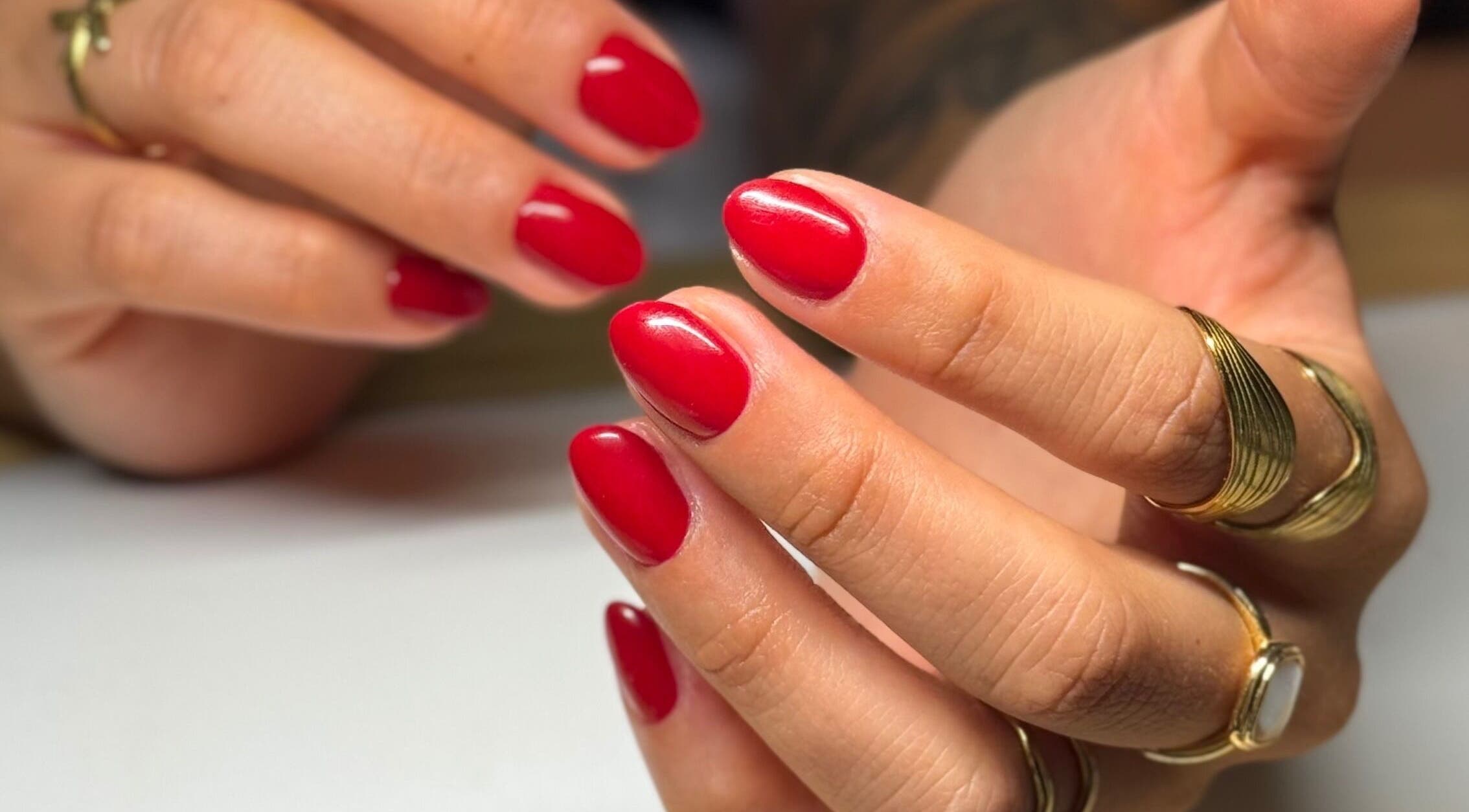 Close-up of red manicured nails at Mano Mona Nails, Bondi Beach, New South Wales, AU.