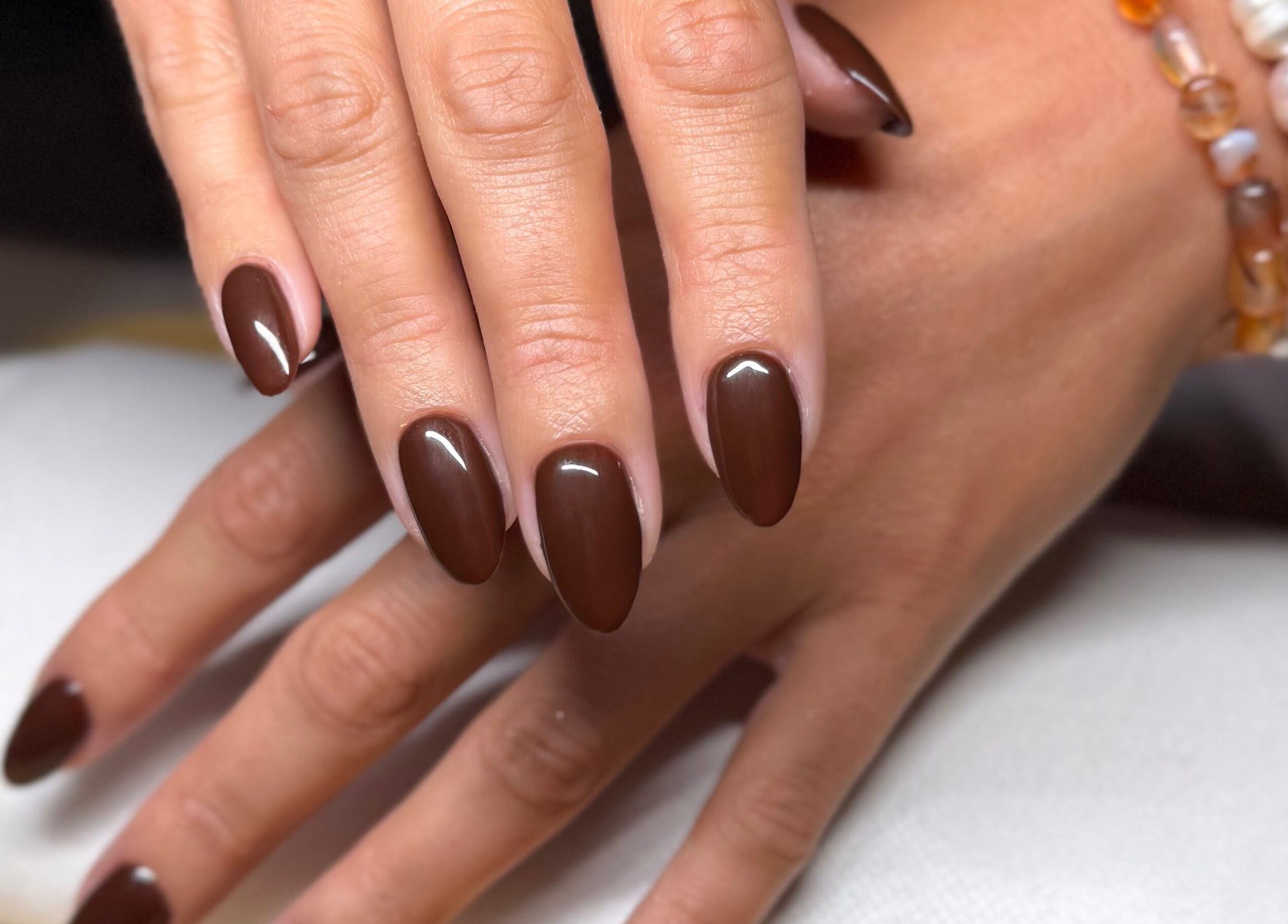 Elegant cocoa nails manicure at Mano Mona Nails, Bondi Beach, New South Wales, AU. Perfectly polished and glossy.