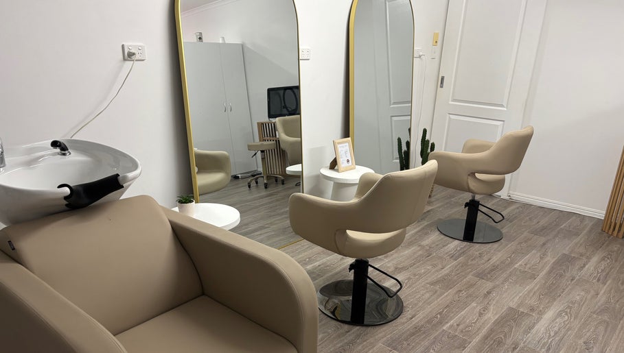 Modern salon chairs and mirrors at Desert Chic Hair in Urangan, Queensland, AU.