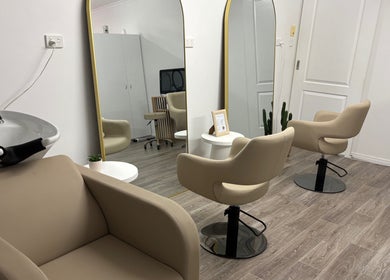 Modern salon chairs and mirrors at Desert Chic Hair in Urangan, Queensland, AU.