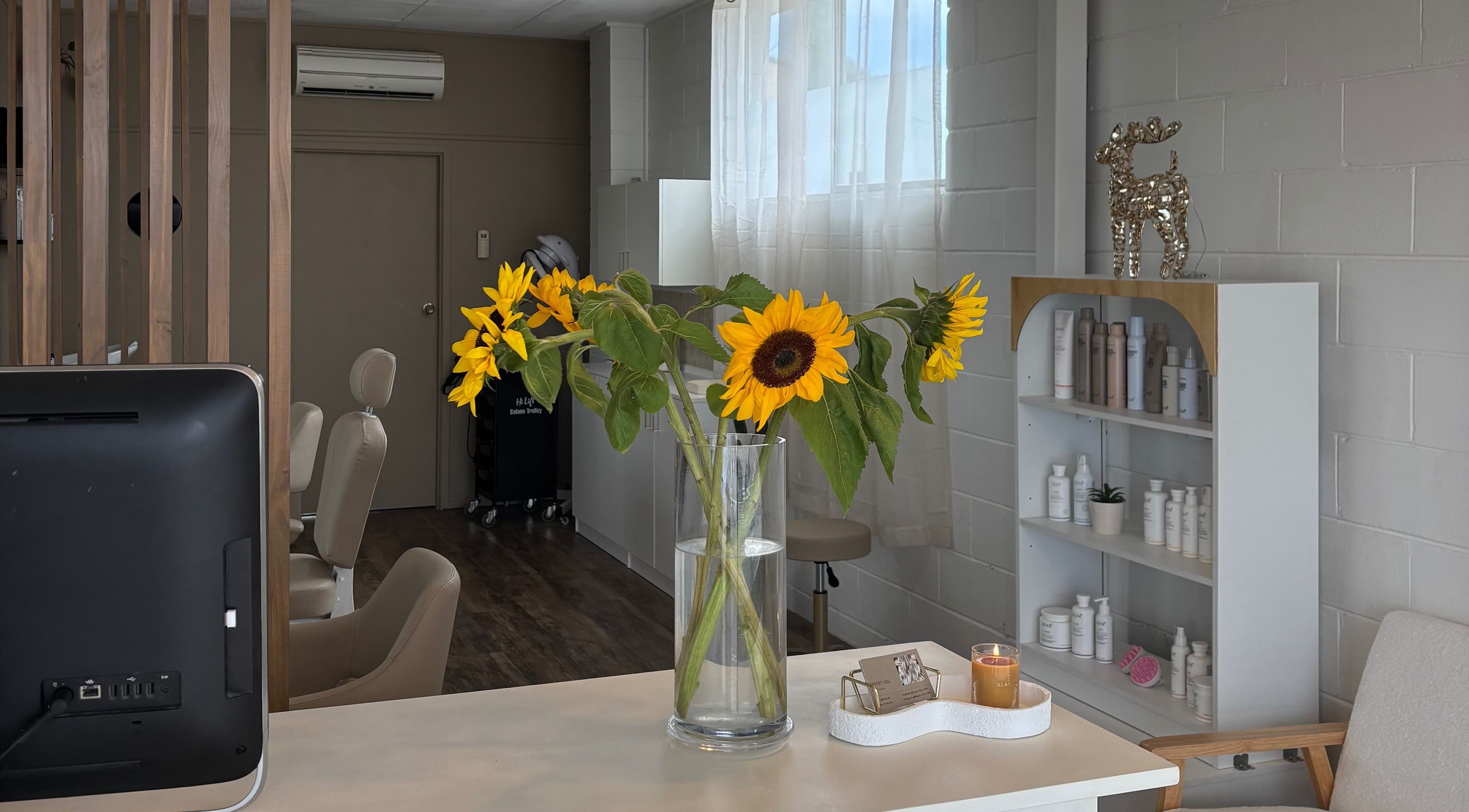 Bright sunflowers at Desert Chic Hair in Pialba, Queensland, create a welcoming atmosphere.
