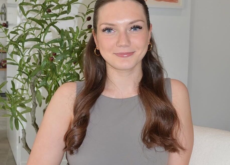 Woman smiling at Lash Artistry by Mikayla, Melbourne, Victoria, AU, showcasing inviting salon atmosphere.