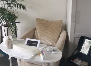 Cozy nail station at EverLuxe Nails in Bilston, Scotland, with a comfy chair and manicure setup.