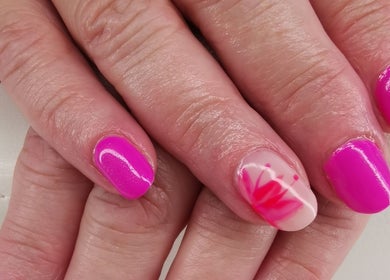 Bright pink manicure with floral nail art at EverLuxe Nails, Bilston, Scotland, GB.