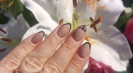 Elegant nail art with black French tips at EverLuxe Nails, Bilston, Scotland, GB.