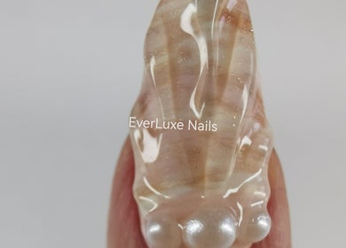 Close-up of elegant glossy nail design at Ever Luxe Nails, Bilston, Scotland, GB showcasing a unique layered style.