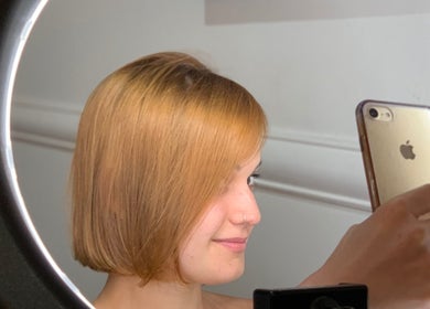 Client taking selfie after hairstyle at Studio MB Hair, Cowra, New South Wales, AU.
