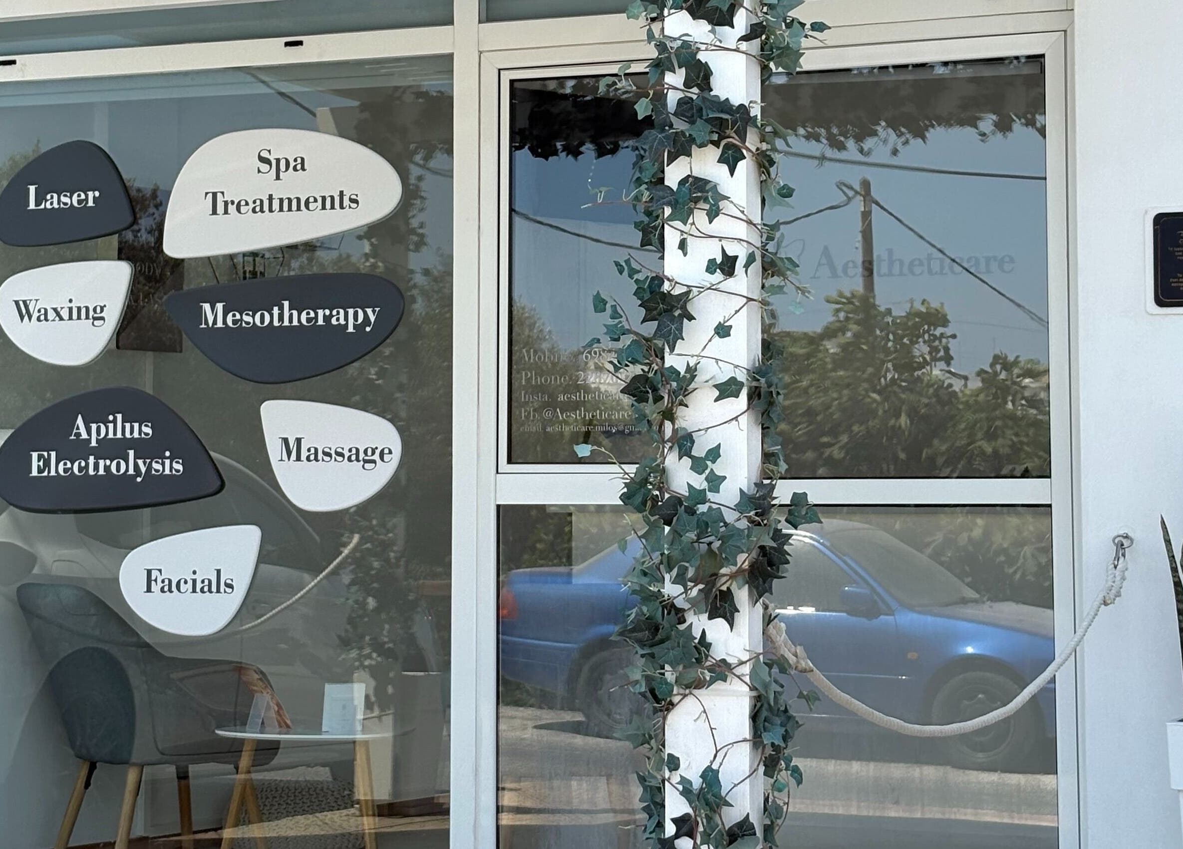 Aestheticare facade in Τριοβάσαλος, GR showcasing spa and beauty treatment options.