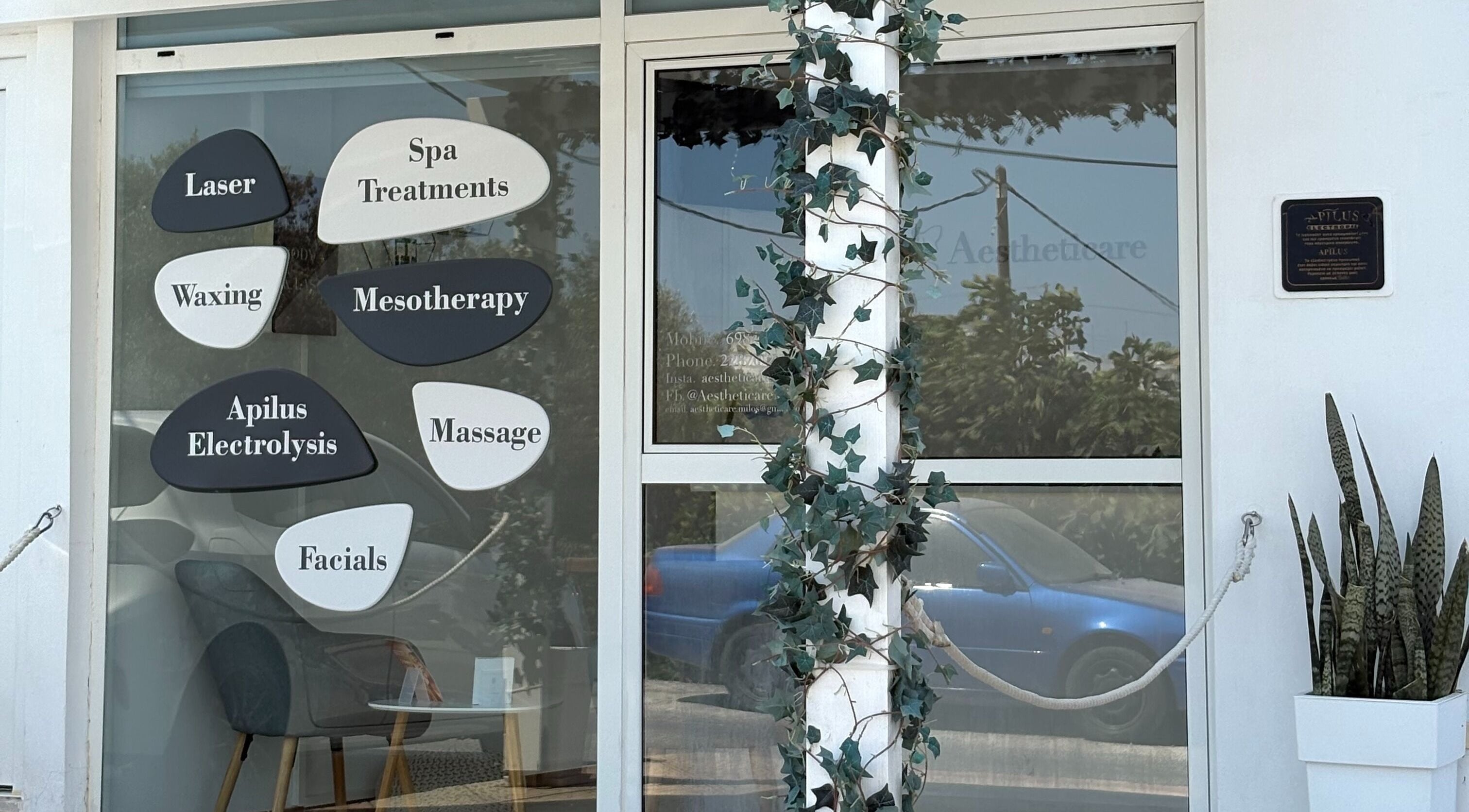 Aestheticare facade in Τριοβάσαλος, GR showcasing spa and beauty treatment options.