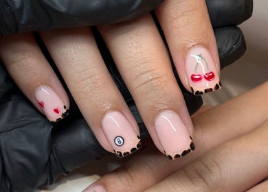 Stylish nail art with cherries and hearts at Glossy Nails, Pontypridd, Wales, GB.