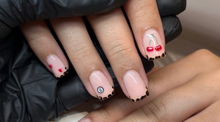 Stylish nail art with cherries and hearts at Glossy Nails, Pontypridd, Wales, GB.