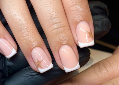 Glossy Nails in Pontypridd, Wales showcases elegant French manicure with gold accents.