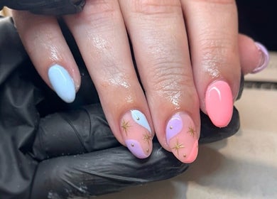 Pastel nail art with celestial design at Glossy Nails in Pontypridd, Wales, GB.