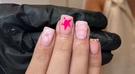 Elegant nail art featuring pink star design at Glossy Nails, Pontypridd, Wales, GB.