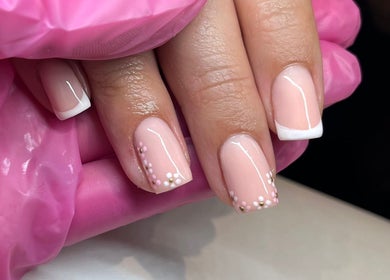 Elegant nail art with floral design at Glossy Nails, Pontypridd, Wales, GB.