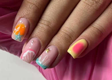 Colorful nail art at Glossy Nails, Pontypridd, Wales featuring vibrant designs and textures.