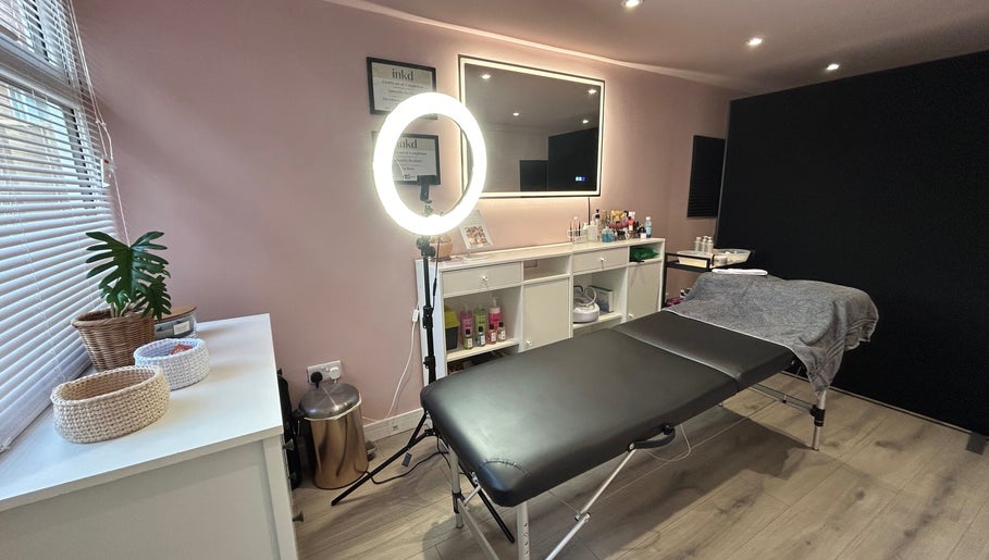 Be Defined Beauty in Billinge, England, GB, showcases a calming treatment room with modern decor and professional setup.