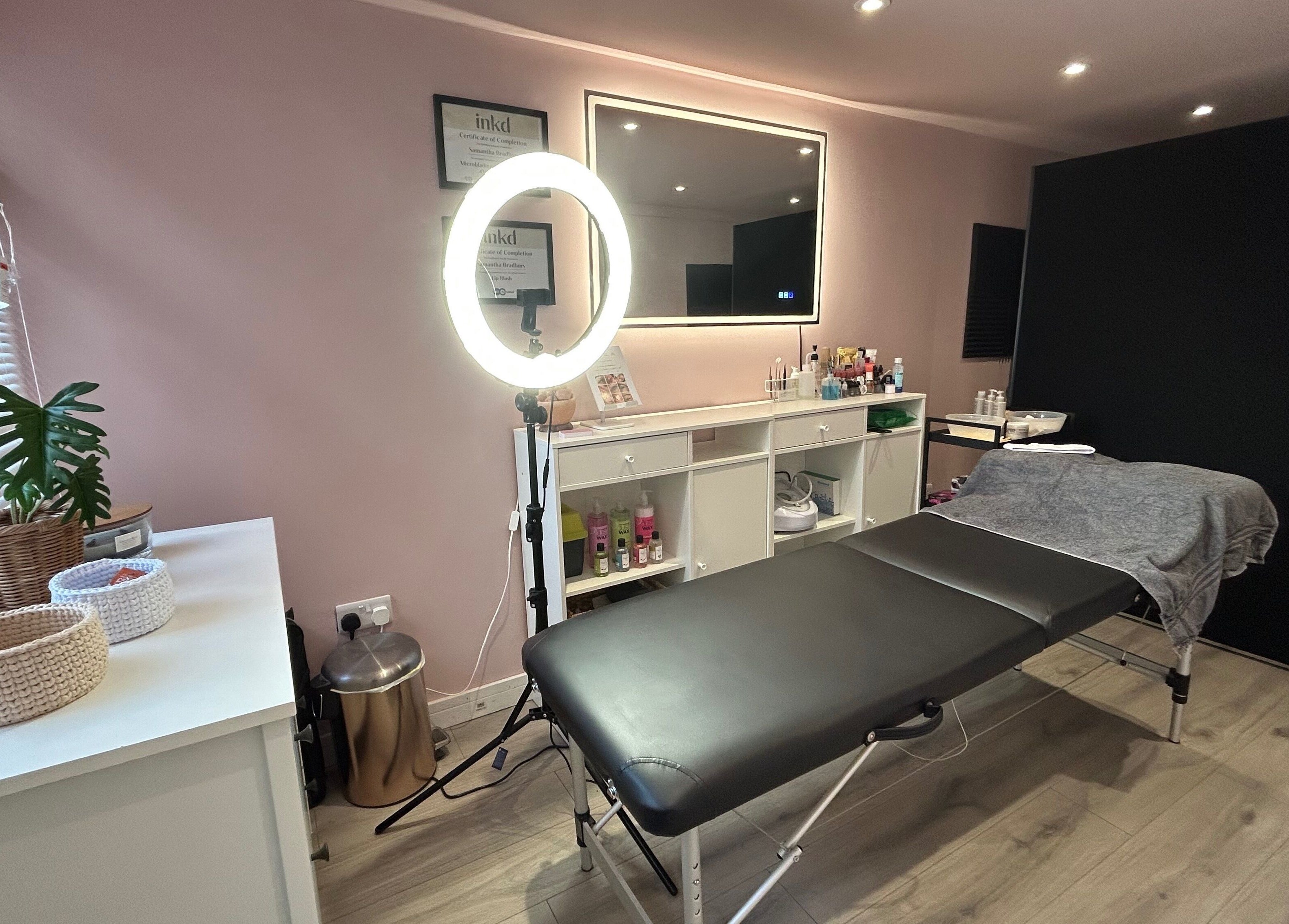 Be Defined Beauty in Billinge, England, GB, showcases a calming treatment room with modern decor and professional setup.