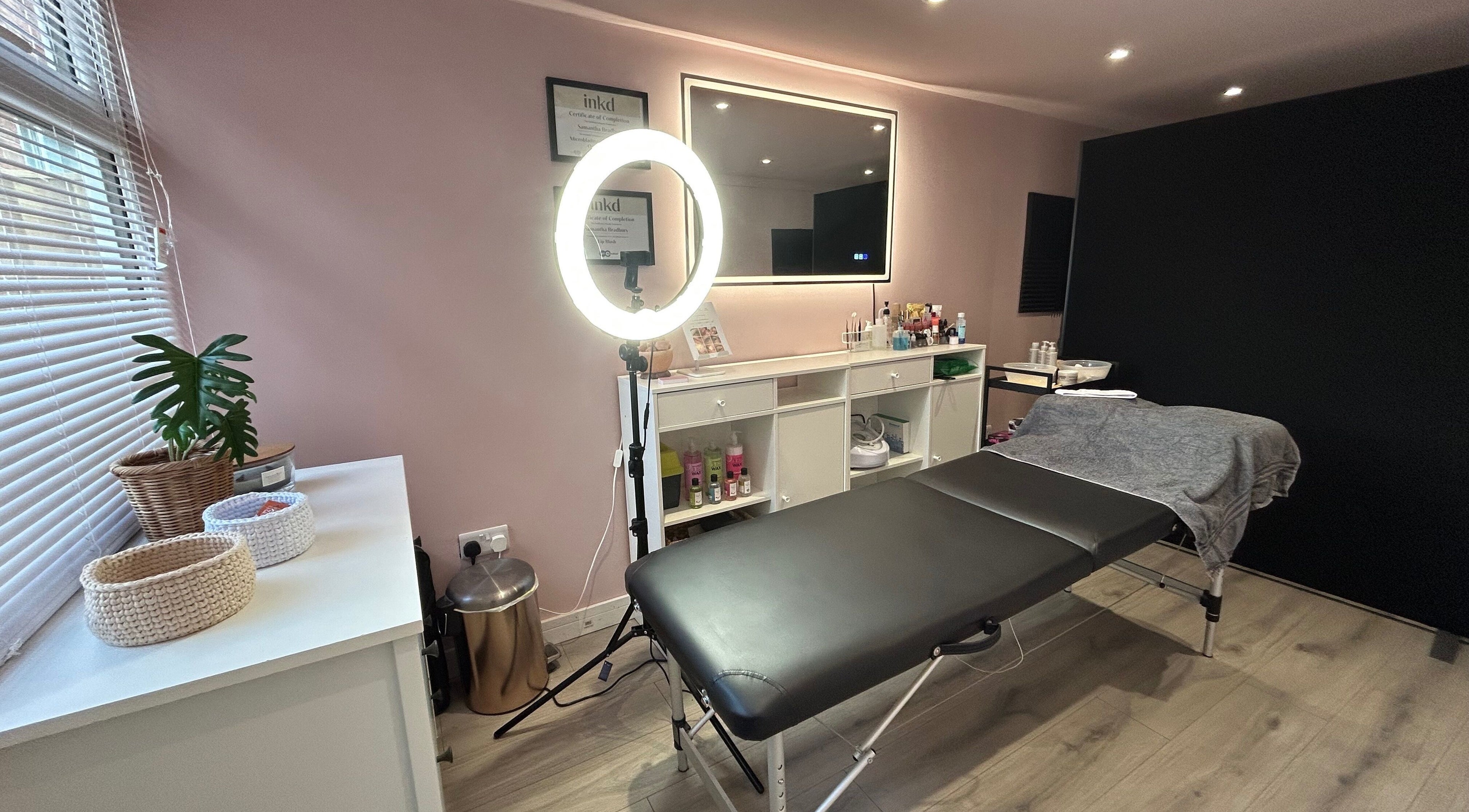 Be Defined Beauty in Billinge, England, GB, showcases a calming treatment room with modern decor and professional setup.