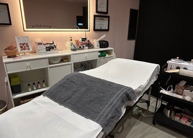 Relaxing beauty treatment room at Be Defined Beauty in Billinge, England, GB, featuring a cozy treatment bed.