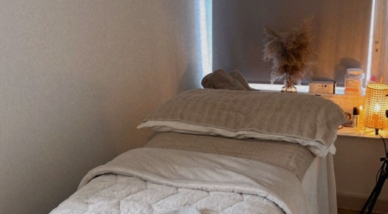 Cozy massage bed at Skin and Sculpt by Victoria Cottle, Honiton, England, GB, offering a tranquil ambiance.