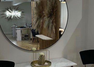 Elegant interior at Extendedbyg, Doncaster, England, GB with stylish decor reflecting in a round mirror.