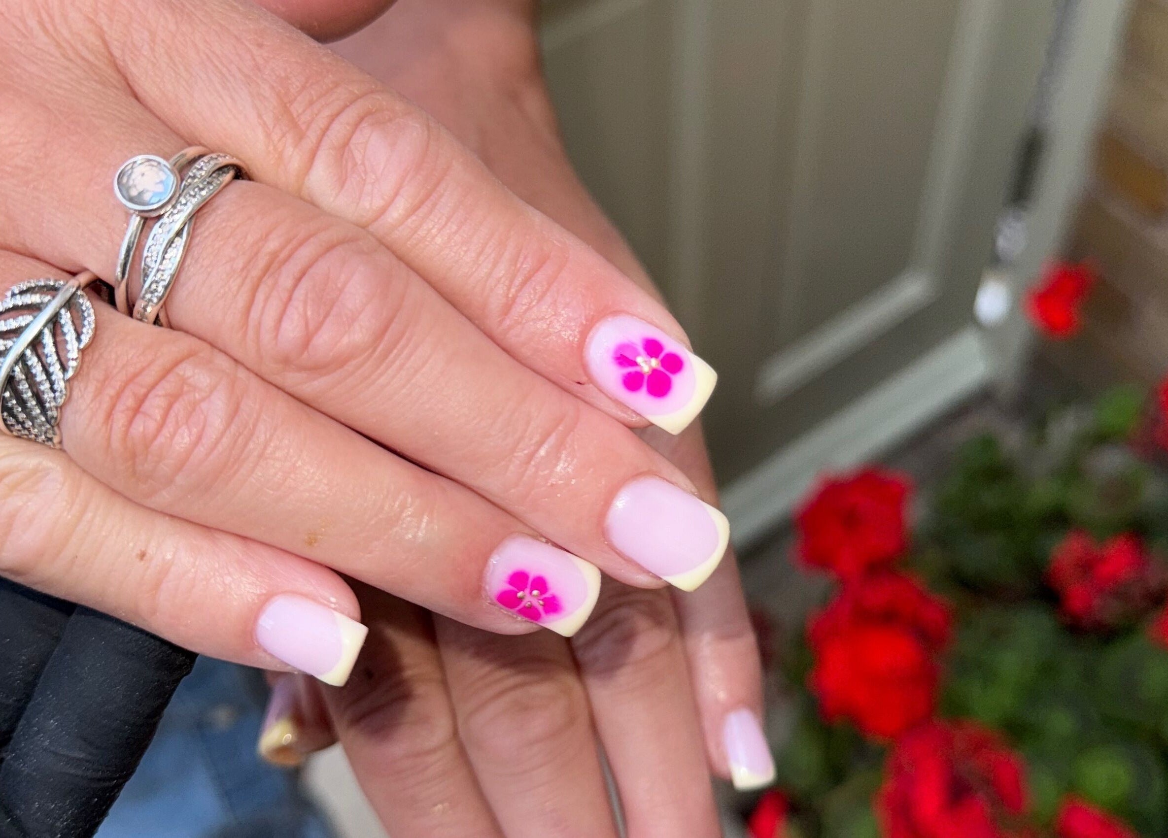 Elegant nail art with pink flower design at Extendedbyg, Doncaster, England, GB.