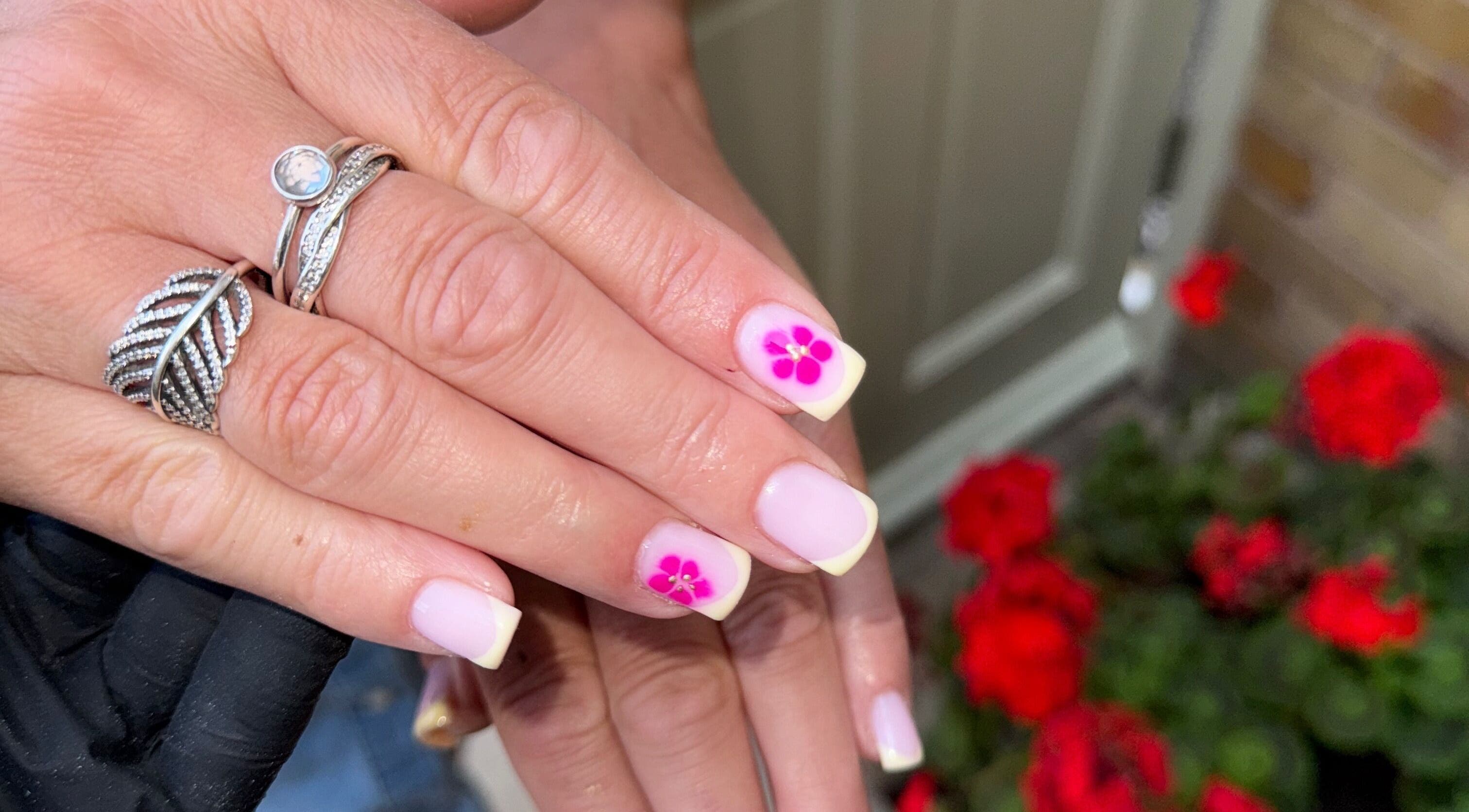 Elegant nail art with pink flower design at Extendedbyg, Doncaster, England, GB.