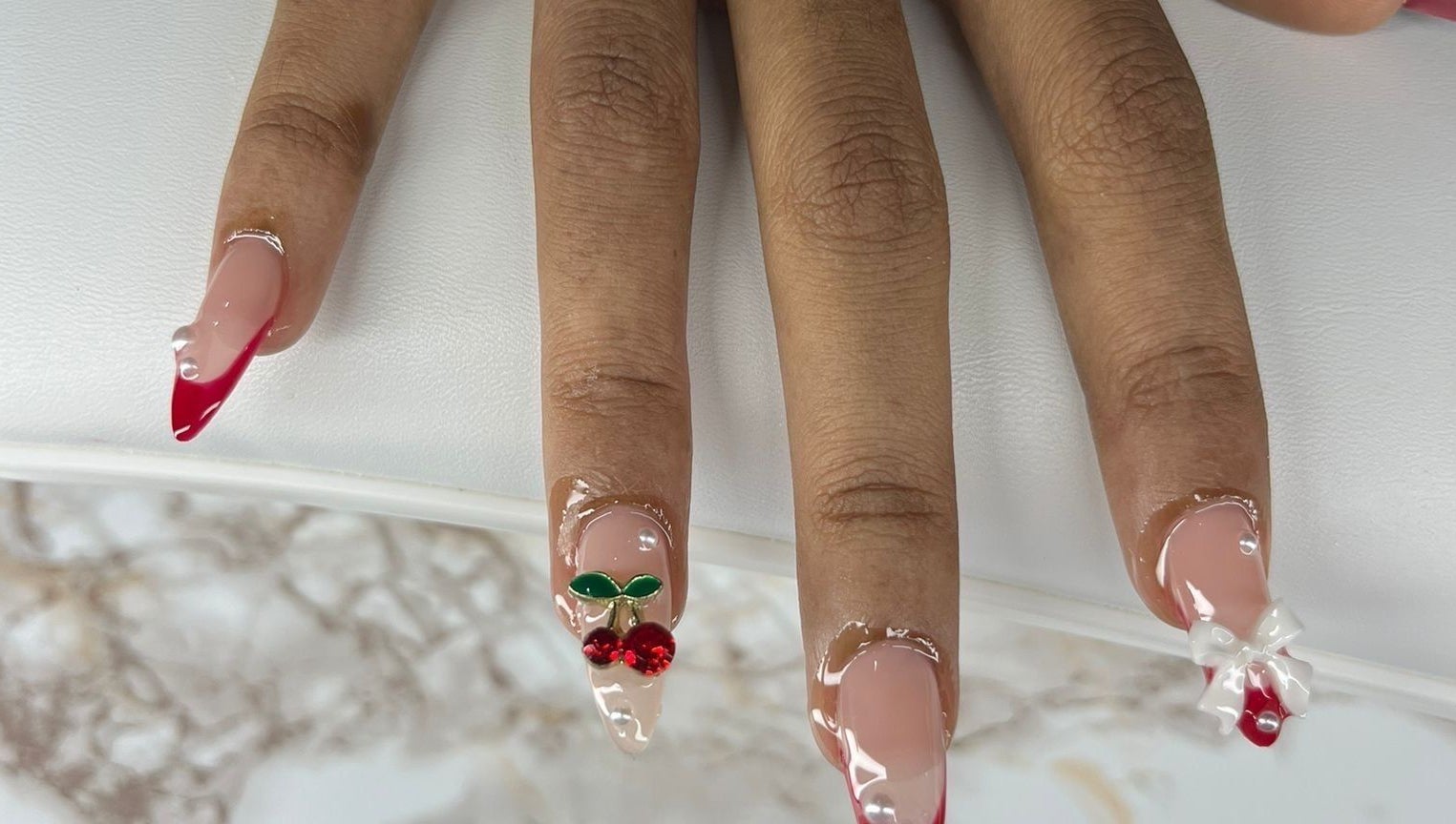 Stylish cherry-themed nail art at Chrissy Aestheticss, Bridgetown, Saint Michael, BB.