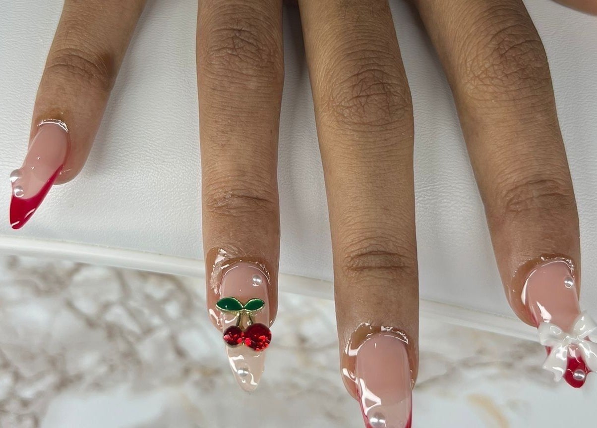 Stylish cherry-themed nail art at Chrissy Aestheticss, Bridgetown, Saint Michael, BB.