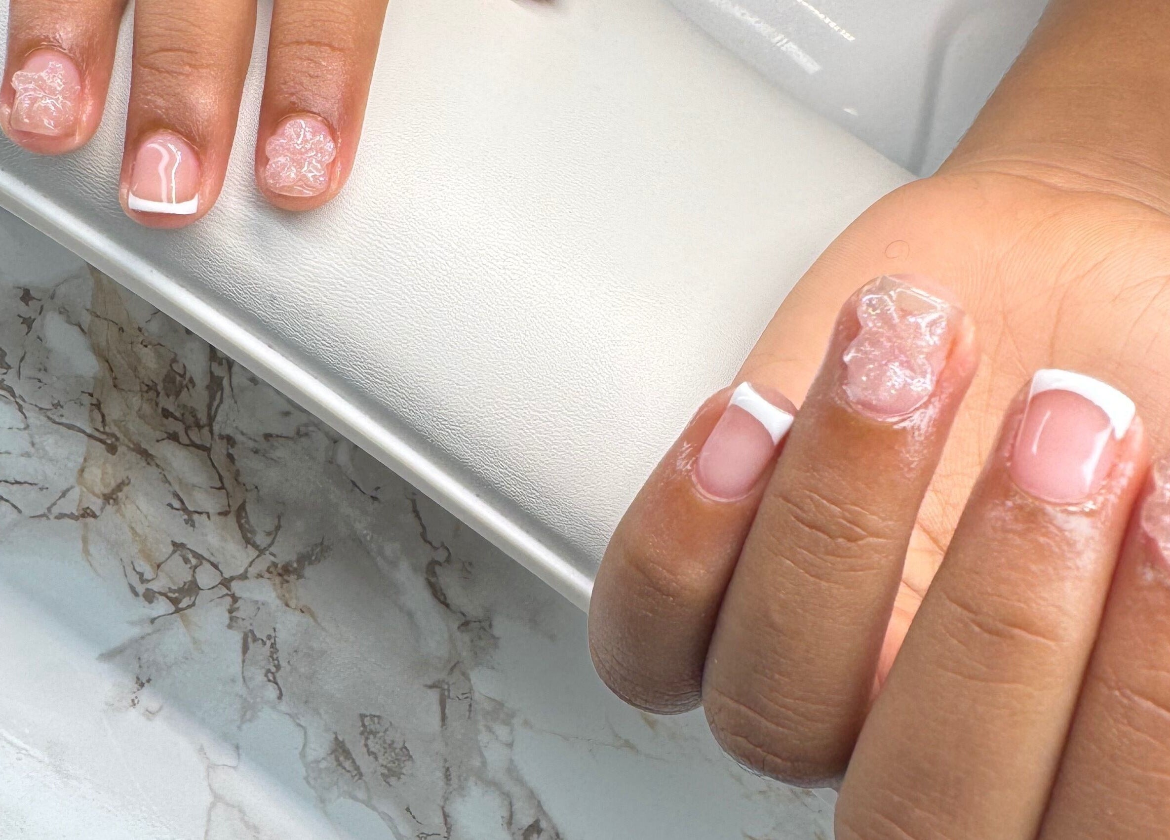Intricate French manicure at Chrissy Aestheticss, Bridgetown, Saint Michael, BB, showcasing elegance and style.