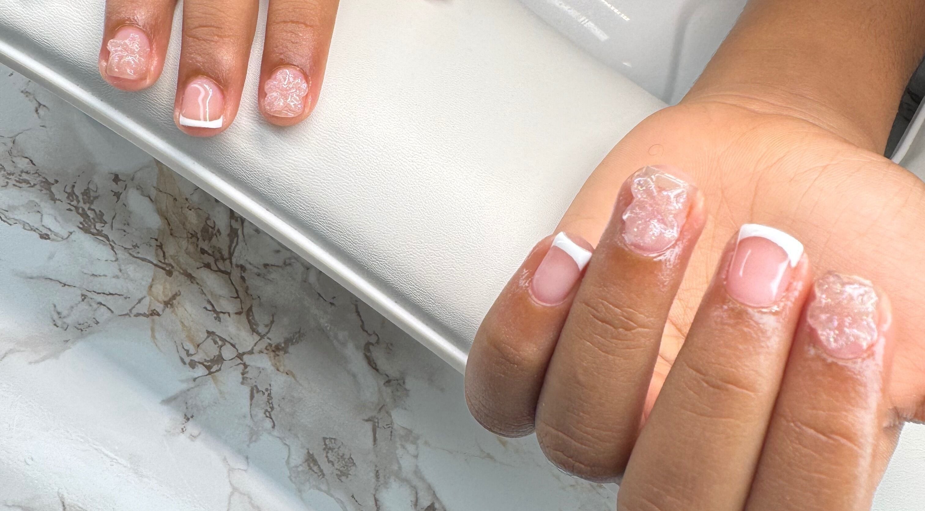 Intricate French manicure at Chrissy Aestheticss, Bridgetown, Saint Michael, BB, showcasing elegance and style.