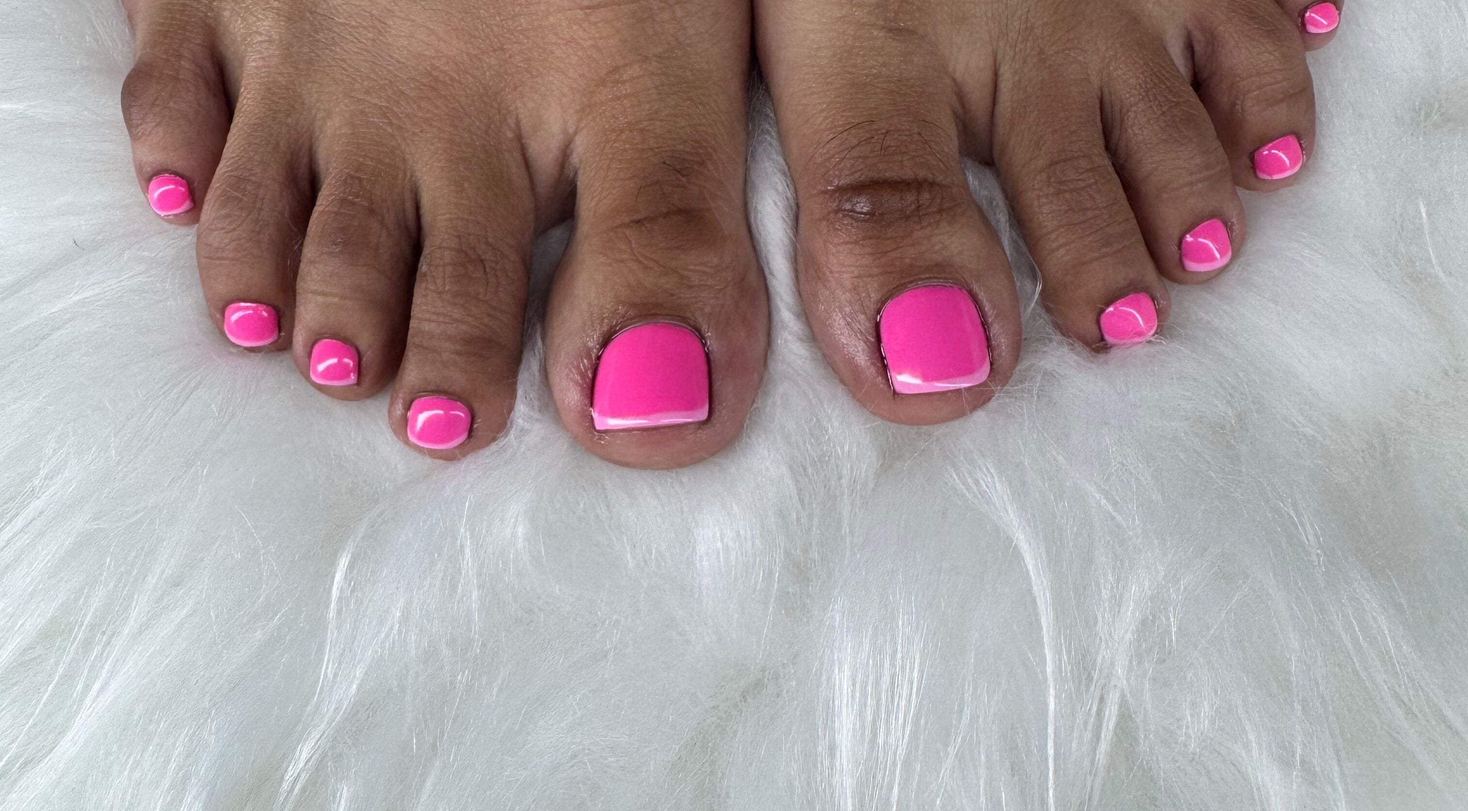 Vibrant pink pedicure on fluffy rug at Chrissy Aestheticss, Bridgetown, Saint Michael, BB.