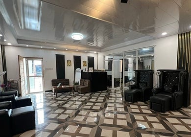 Elegant interior of DC Beauty Lounge in Mangatarem, Ilocos Region, PH featuring modern design and plush seating.