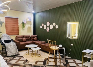 Elegant interior of DC Beauty Lounge in Mangatarem, Ilocos Region, PH with plush seating and modern decor.