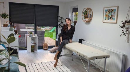 Peaceful treatment room at Beautician NK, London, England, GB with massage table and bright decor.