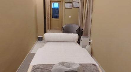 Relaxing massage room at Biomechanic Jana, Београд, RS, offering a serene wellness experience.