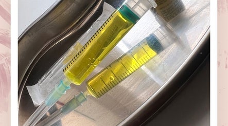 Yellow syringes at Glowaestheticbyjaz, London, England, GB highlighting professional beauty treatments.