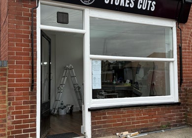 Front exterior view of Stokes Cuts, a beauty salon in Broadstairs, England, GB, showcasing its inviting facade.