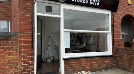 Front exterior view of Stokes Cuts, a beauty salon in Broadstairs, England, GB, showcasing its inviting facade.