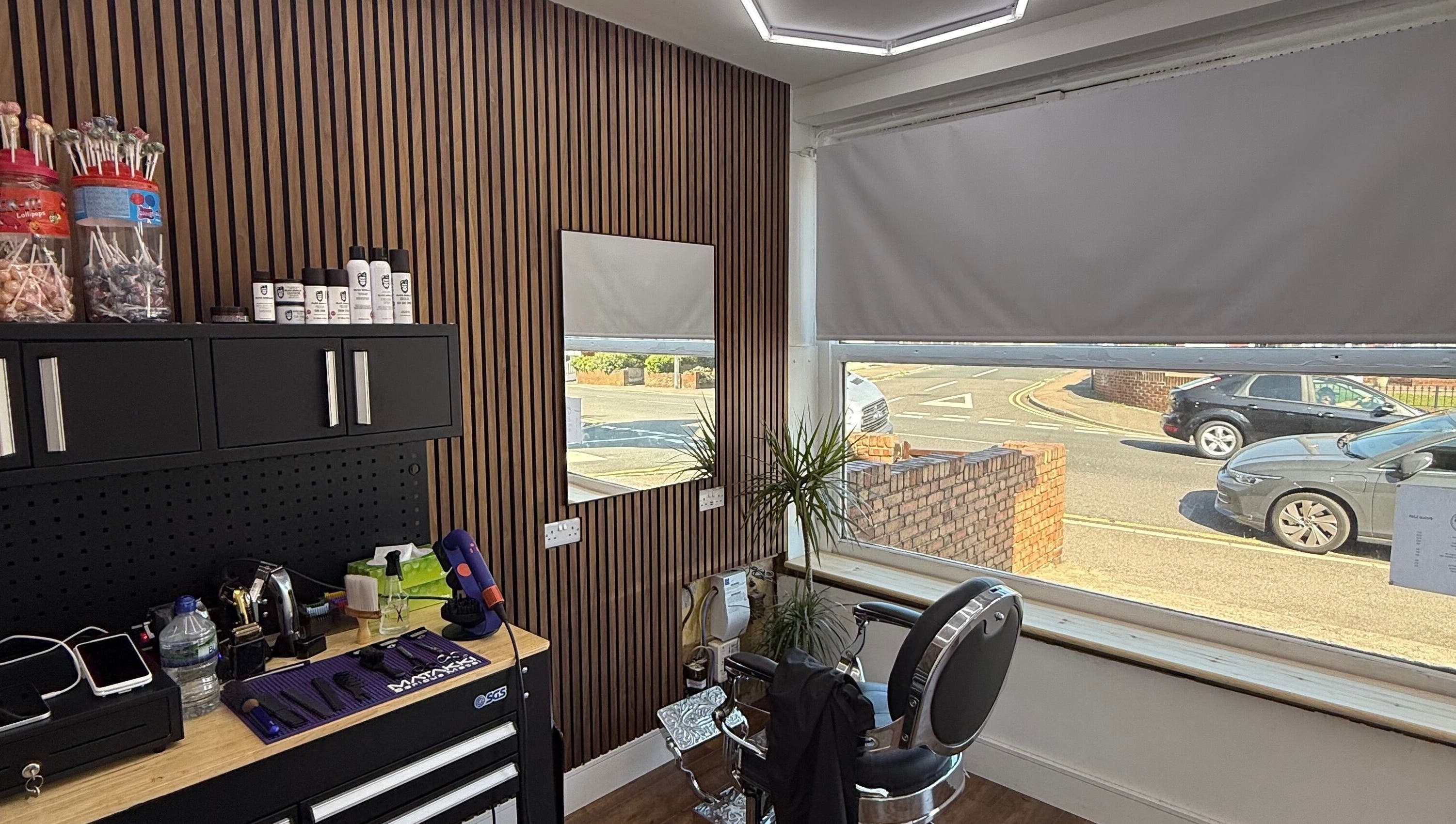 Interior view of Stokes Cuts in Broadstairs, England, showing a modern salon chair and grooming tools.