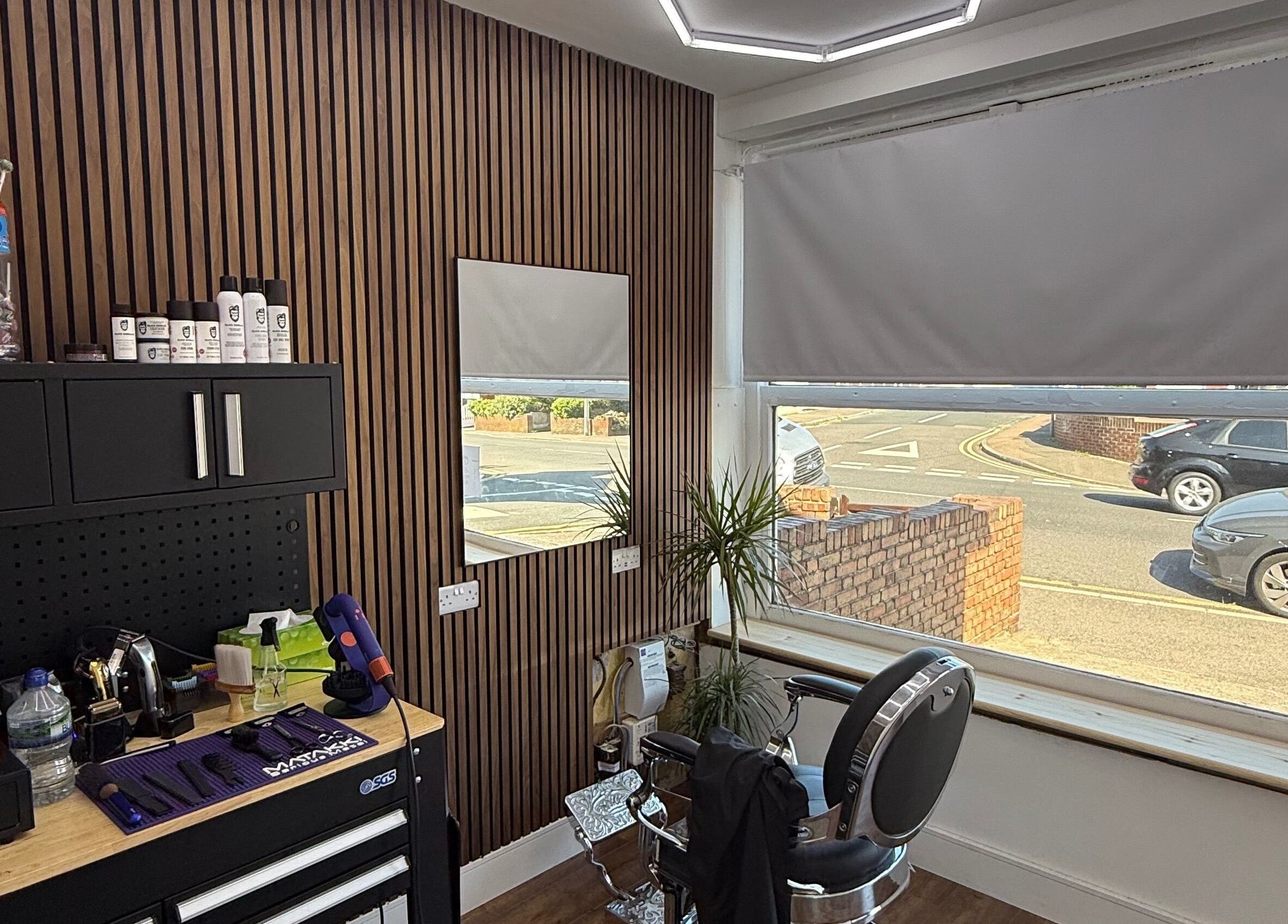 Interior view of Stokes Cuts in Broadstairs, England, showing a modern salon chair and grooming tools.