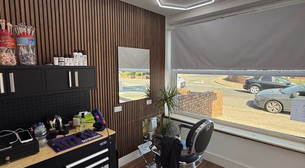 Interior view of Stokes Cuts in Broadstairs, England, showing a modern salon chair and grooming tools.