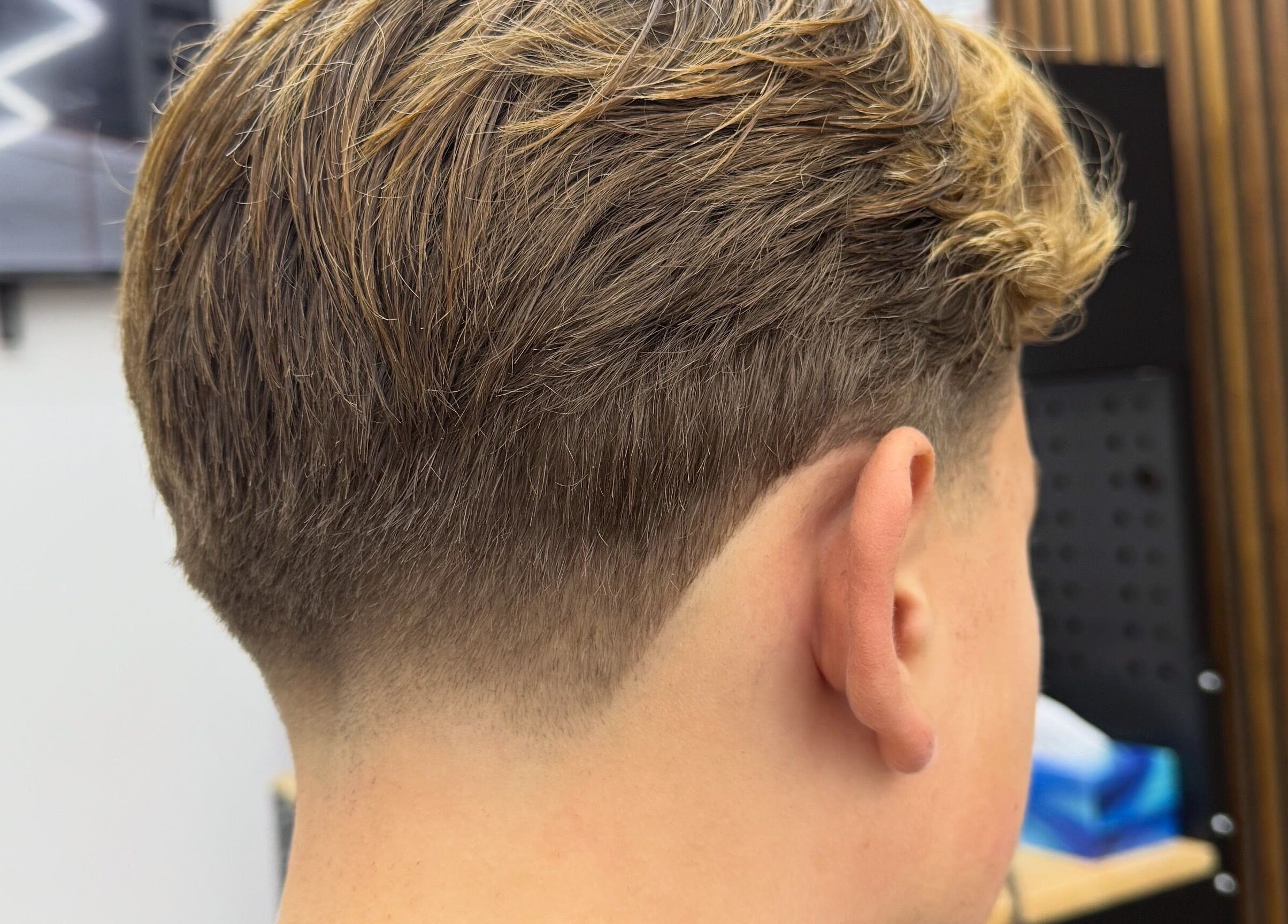 Fresh undercut style at Stokes Cuts in Broadstairs, England, GB, showcasing precise barbering skills.
