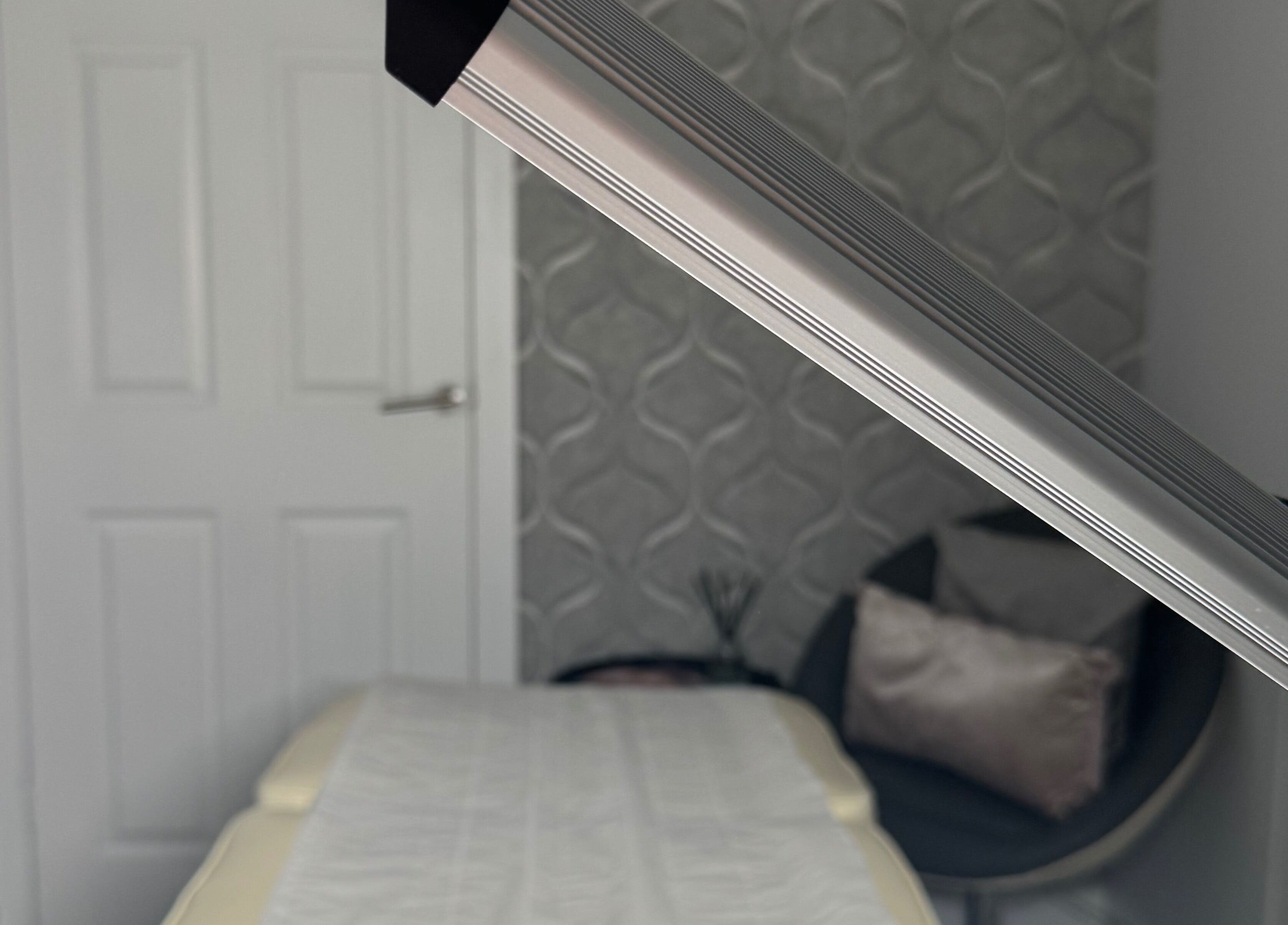 Tranquil treatment room at Total Aesthetics Clinic, Wisbech, England, GB with comfortable bed and modern decor.