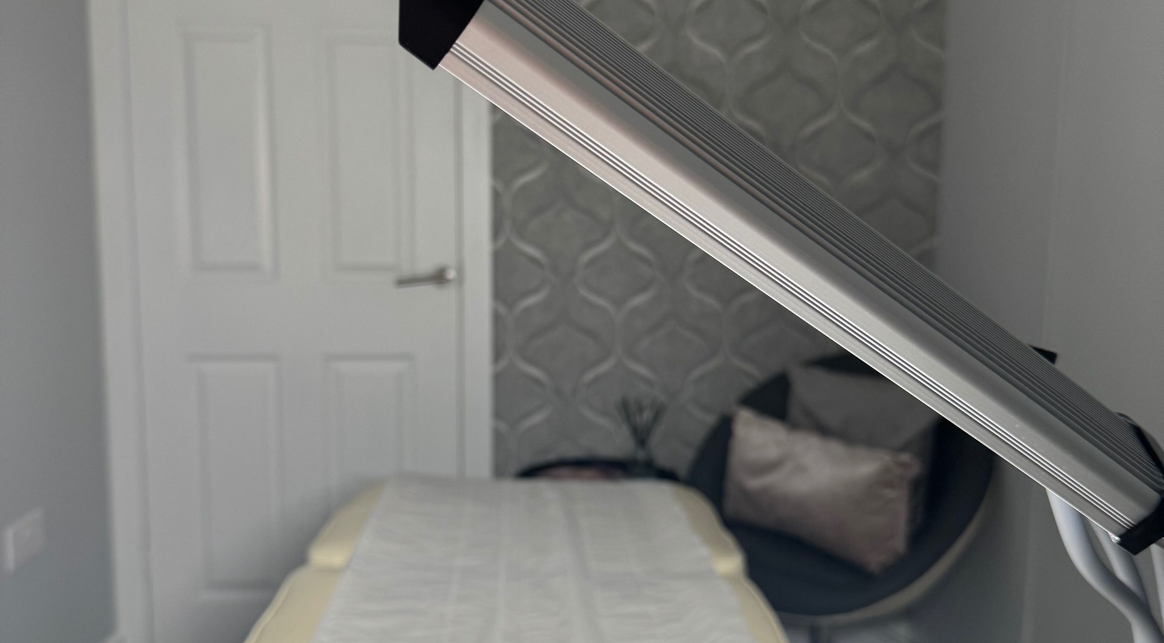 Tranquil treatment room at Total Aesthetics Clinic, Wisbech, England, GB with comfortable bed and modern decor.