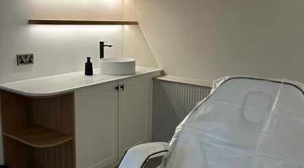 Treatment room at Pause Beauty & Holistic, Chew Magna, England, GB featuring a cozy chair and modern sink.