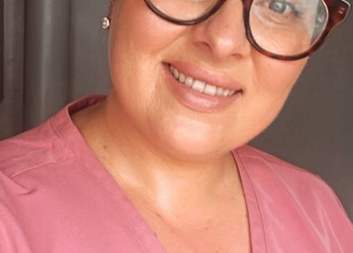 Friendly staff member at Pause Beauty & Holistic in Chew Magna, England, enhancing client experience.