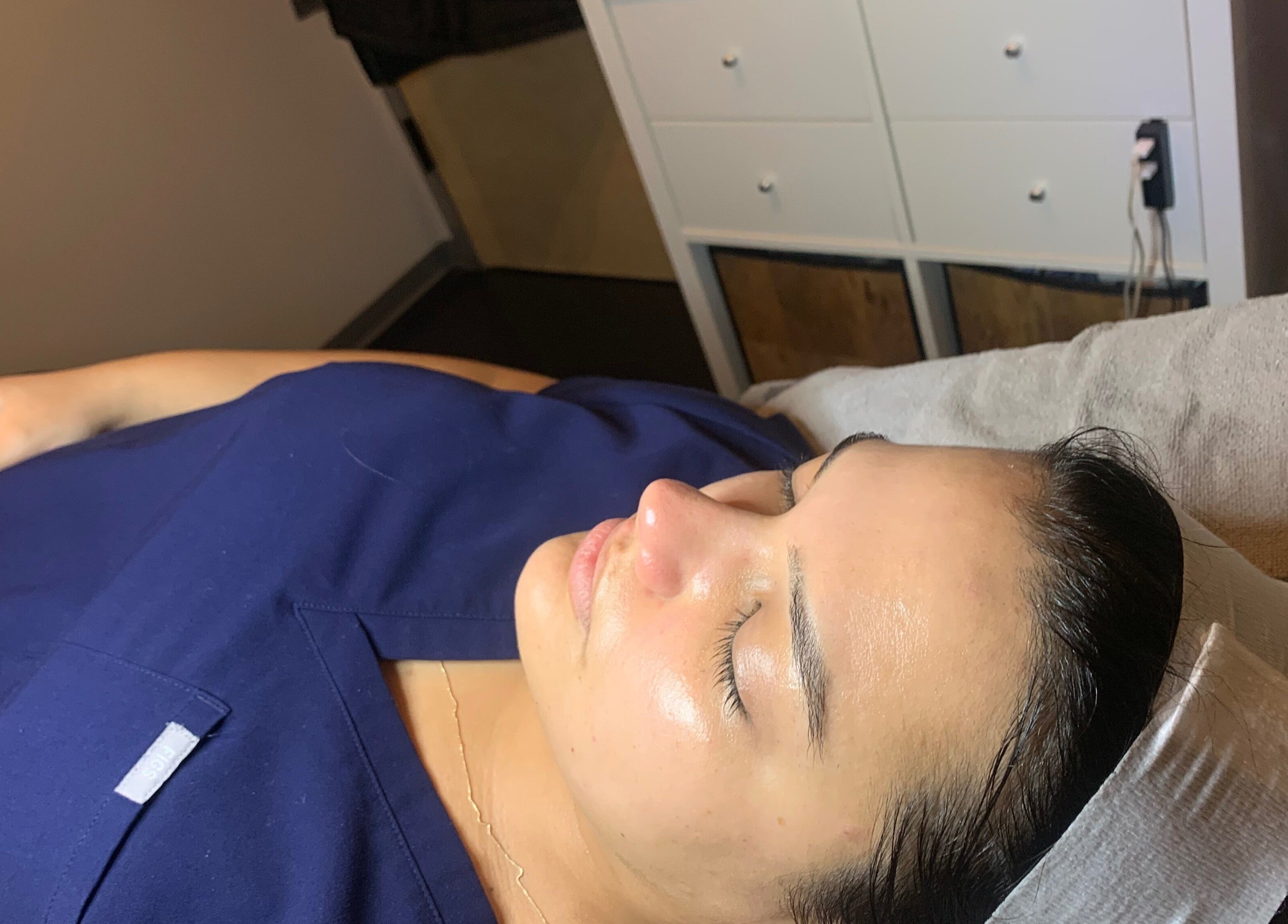 Client enjoying a facial at Peach & Fox in New York, New York, US, showcasing relaxation and wellness.