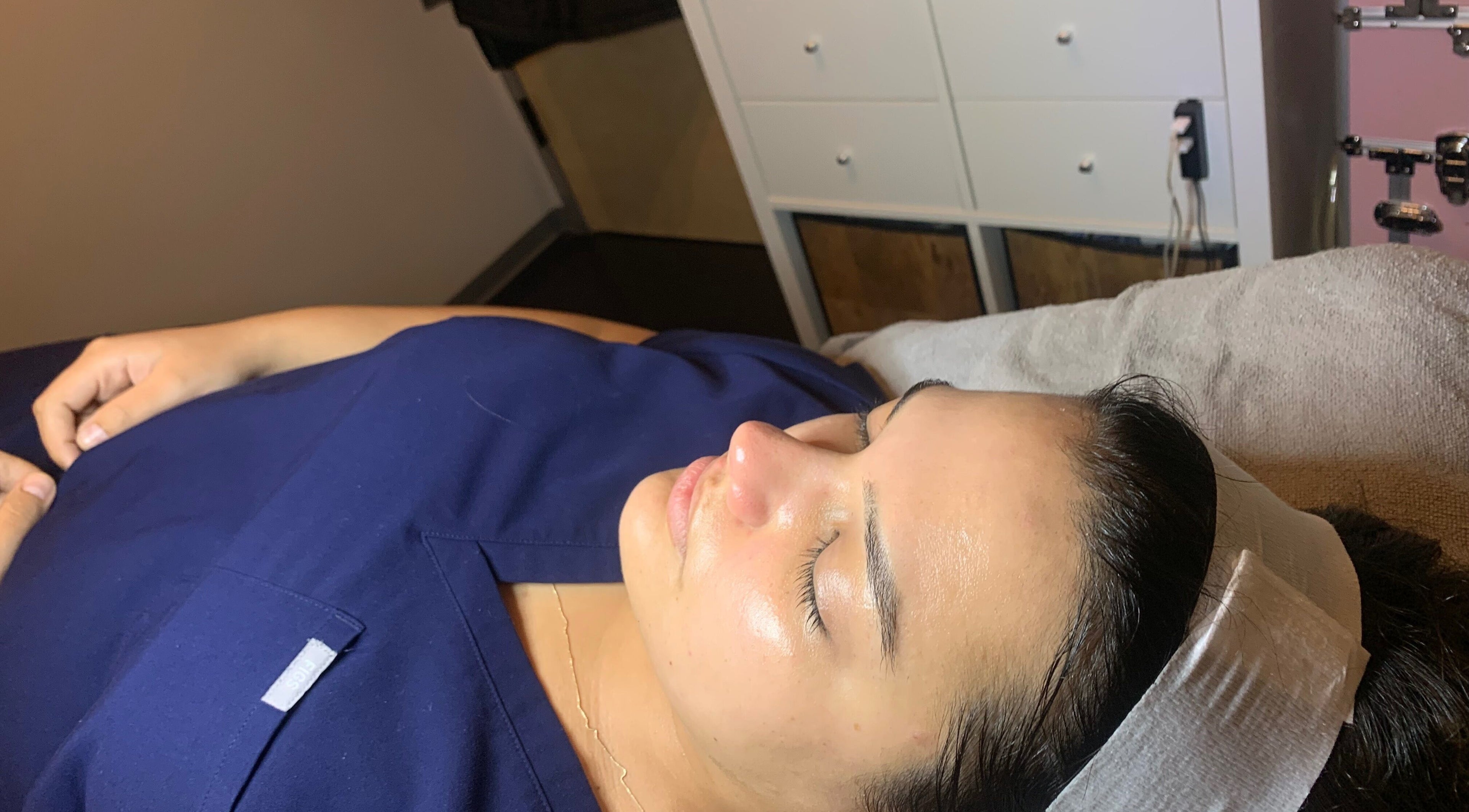 Client enjoying a facial at Peach & Fox in New York, New York, US, showcasing relaxation and wellness.